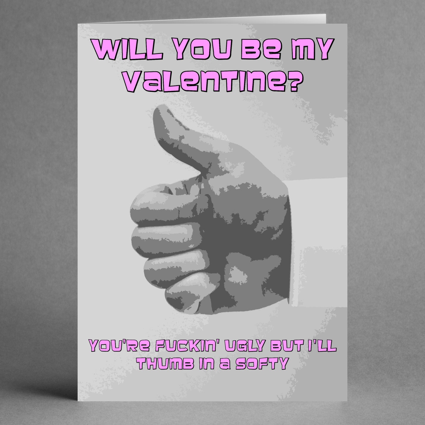 The Thumb In A Softy Twisted Valentine's Card from Twisted Gifts adds a unique twist to traditional romance with its playful thumbs-up image and cheeky pink text: "Will you be my valentine?" and "You're fuckin' ugly but I'll thumb in a softy.