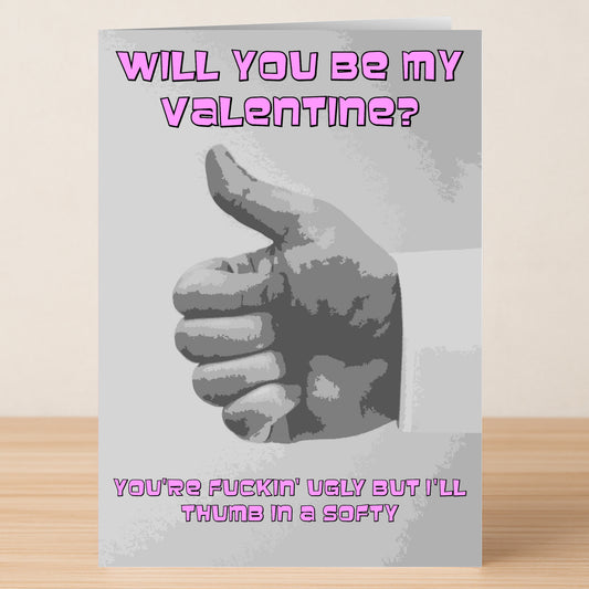 The "Thumb In A Softy Twisted Valentine's Card" by Twisted Gifts features a grayscale thumbs-up and bold pink text: "Will you be my Valentine? You're fuckin' ugly but I'll thumb in a softy." Perfect for those with a twisted sense of humor.