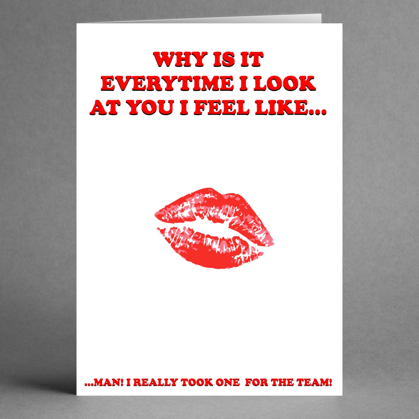 The Team Insulting Valentine's Card from Twisted Gifts features a playful red lipstick kiss at the center, with the humorous message: "Why is it every time I look at you I feel like... man! I really took one for Team Insulting Valentine's Card." It's a cheeky twist perfect for your favorite teammate!