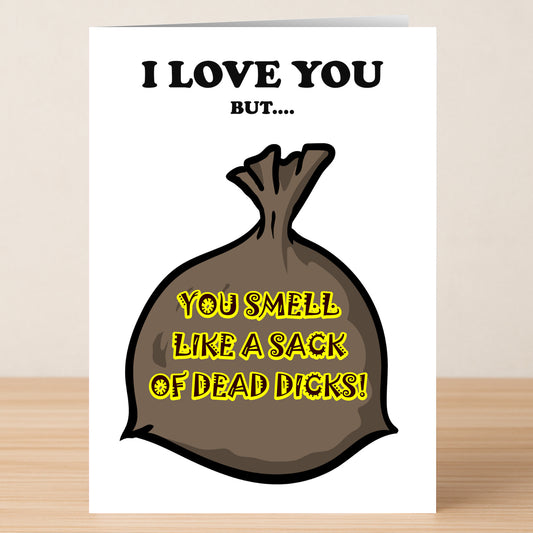 The Sack Very Twisted Valentine's Card by Twisted Gifts features “I LOVE YOU BUT…” above a brown sack labeled “YOU SMELL LIKE A SACK OF DEAD DICKS!”—a hilarious, unique card for those with a wicked sense of humor.