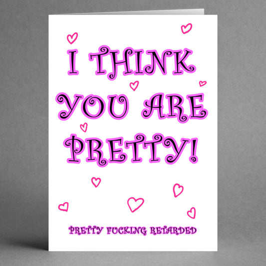 Introducing the "Retard Insulting Valentine's Card" by Twisted Gifts, featuring vibrant pink text that boldly declares "I think you are pretty!" amidst a flurry of hearts, complemented by a cheeky message at the bottom that reads, "Pretty fucking retarded.