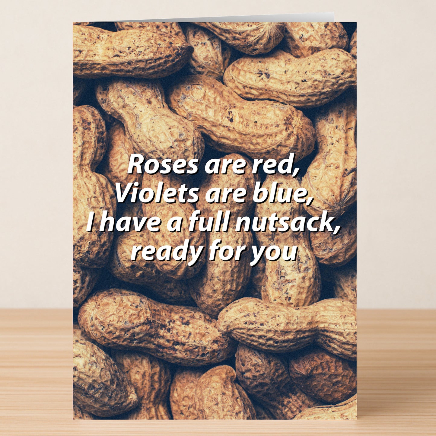The Nut Sack Twisted Valentine's Card by Twisted Gifts features unshelled peanuts and the cheeky message: "Roses are red, Violets are blue, I have a full nutsack, ready for you." Perfect for fans of playful, unconventional Valentine's greetings.