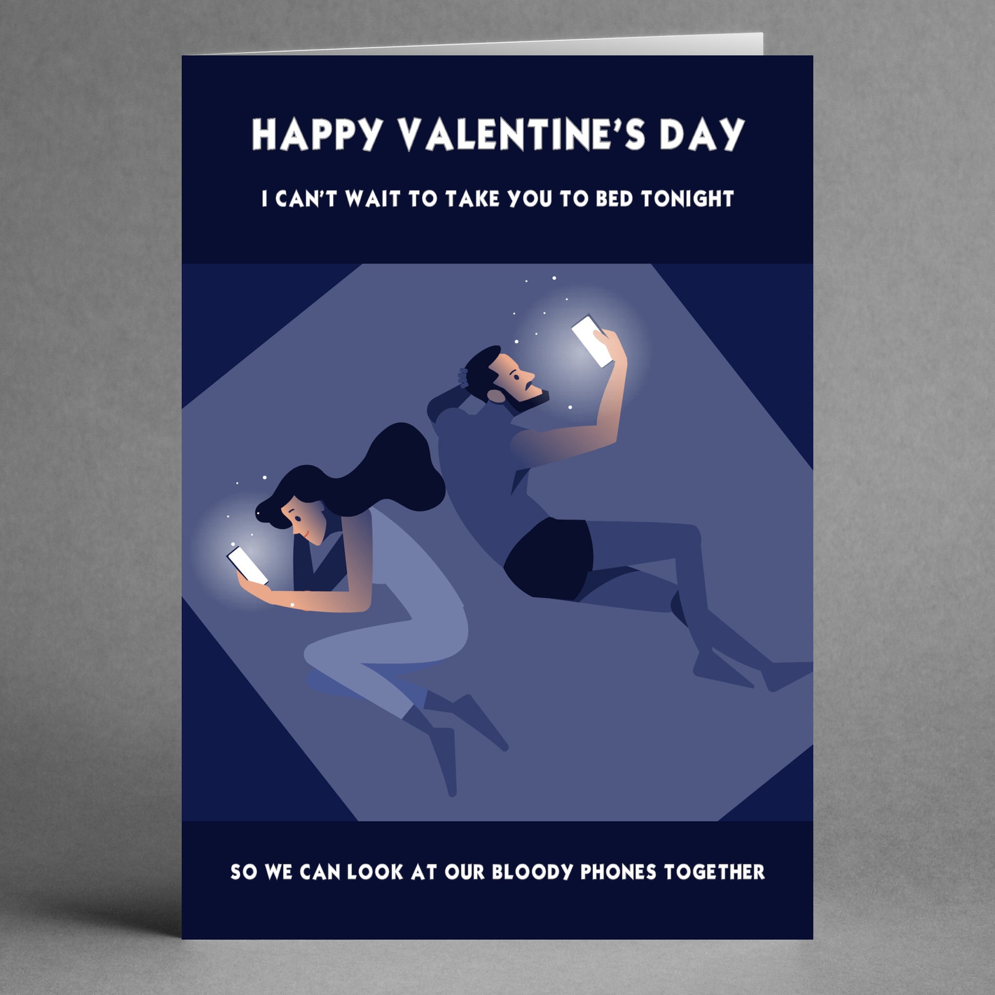 The "Bloody Phones Funny Valentine's Card" by Twisted Gifts humorously depicts a tech-savvy couple each absorbed in their phones, capturing the essence of modern romance with a playful twist.