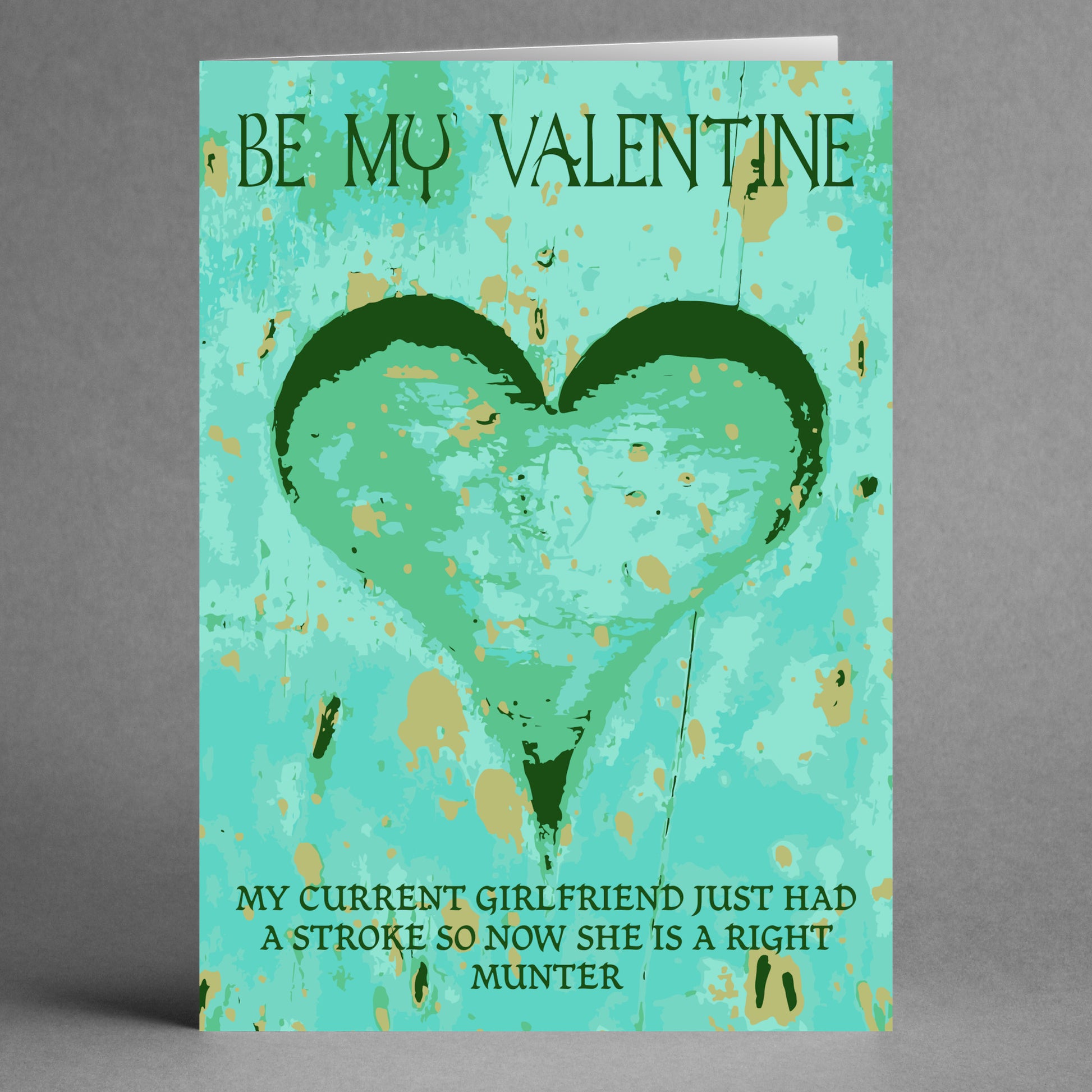 Introducing the Munter Insulting Valentine's Card from Twisted Gifts – a one-of-a-kind card adorned with a green heart and the playful message: "Be My Valentine. My current girlfriend just had a stroke, so now she is a right munter." It's the perfect humorous gift for anyone who enjoys some tongue-in-cheek fun!