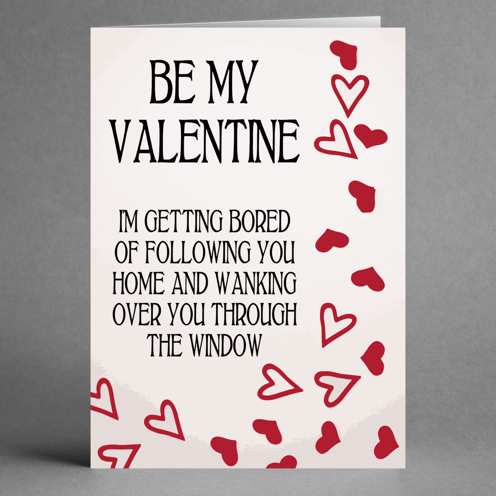 A humorously designed Valentine's Day card from Twisted Gifts, the "Getting Bored Twisted Valentine's Card," features red hearts and playful text about following someone home and waving through the window.