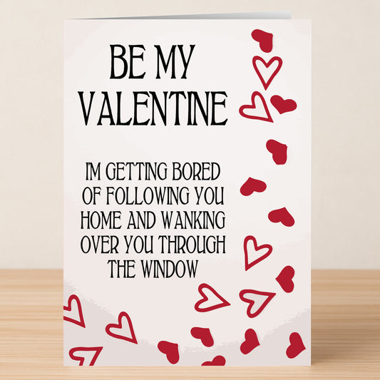 The Getting Bored Twisted Valentine's Card by Twisted Gifts features the cheeky message, "Be my Valentine. I'm getting bored of following you home and wanking over you through the window," with playful red hearts.