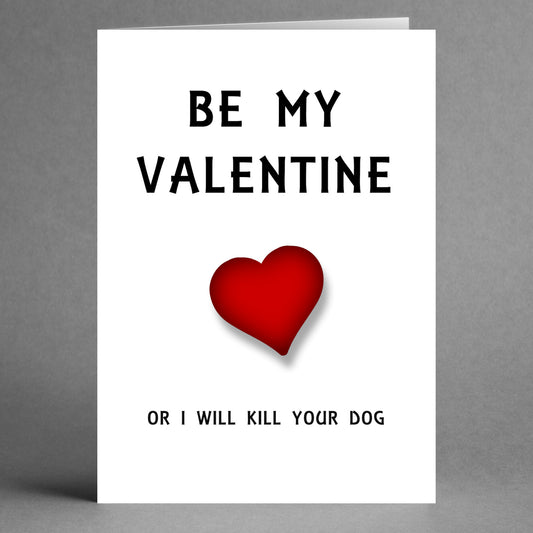 The "Dog Gets It Twisted Valentine's Card" by Twisted Gifts features a bold "Be my Valentine" message above a red heart, with the humorous twist of "or I will kill your dog" on a gray background.