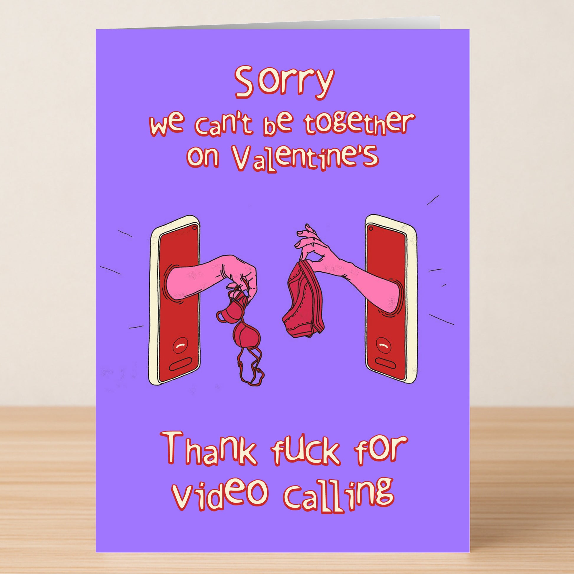 The Twisted Gifts Video Calling Rude Valentine's Card features two hands swapping lingerie through phone screens—a playful way to celebrate staying connected, even from afar.