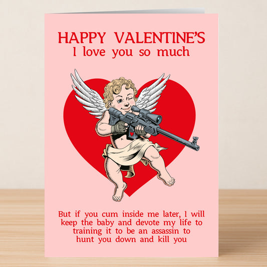 The Assassin Funny Valentine's Card by Twisted Gifts features a winged cherub with a sniper rifle in front of a red heart and witty, slightly threatening text—perfect for anyone with a playful sense of humor this Valentine’s Day.