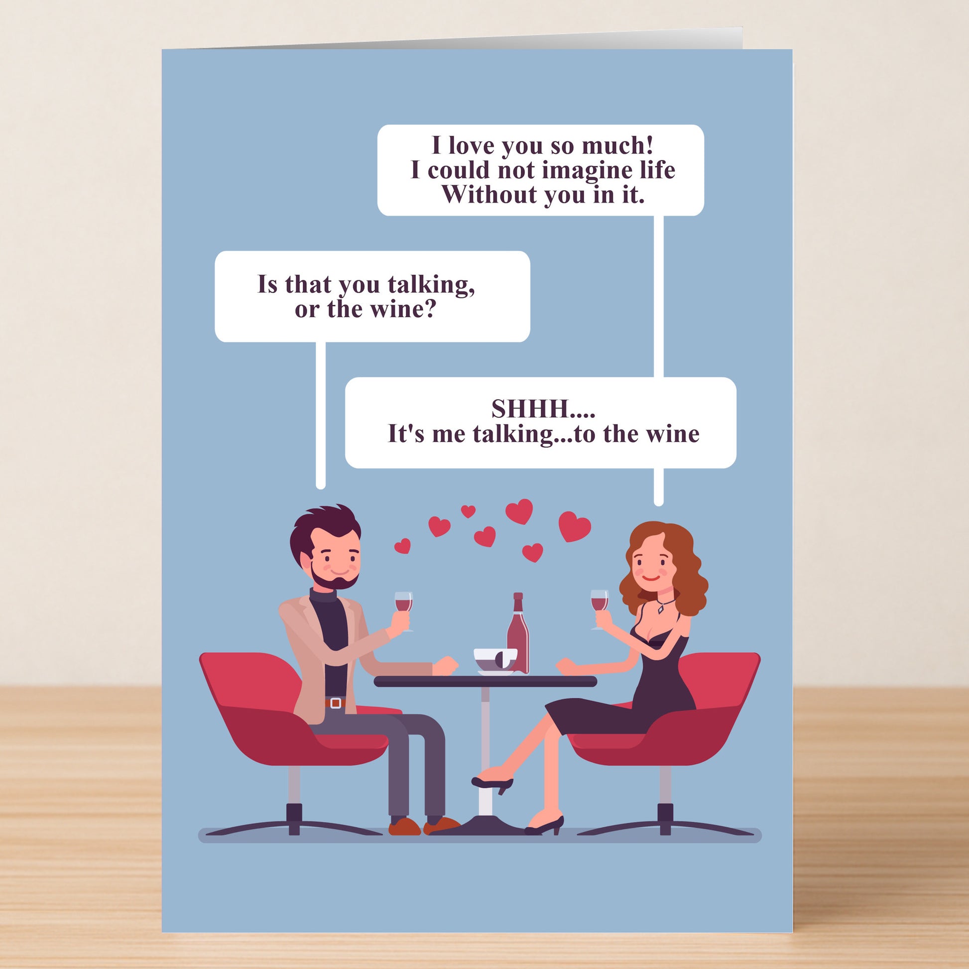 The Wine Funny Greeting Card by Twisted Gifts features a man and woman with wine, sharing a witty love message with floating hearts—ideal for Valentine’s Day.