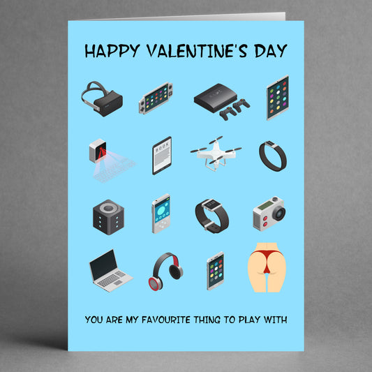 The Favourite Thing Funny Valentine's Card by Twisted Gifts features an array of gadget illustrations on a blue background, accompanied by the text: "Happy Valentine's Day" and "You are my favorite thing to play with." This amusing card is the perfect way to share your love with a playful twist.