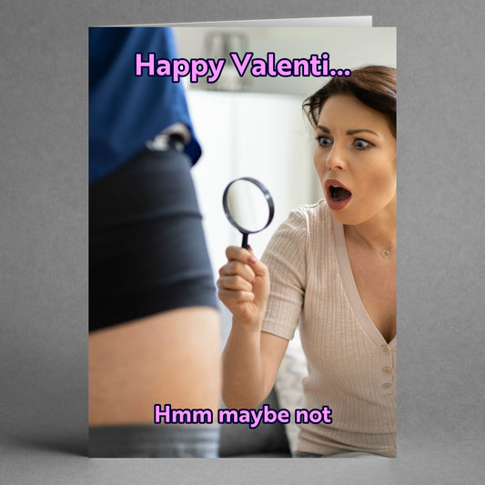 A woman holds a magnifying glass, looking surprised at a man's clothed leg. The text reads, "Happy Valenti... Hmm maybe not." This humorous card from Twisted Gifts, named "Maybe Not Funny Valentines Card," is guaranteed to spark laughter!