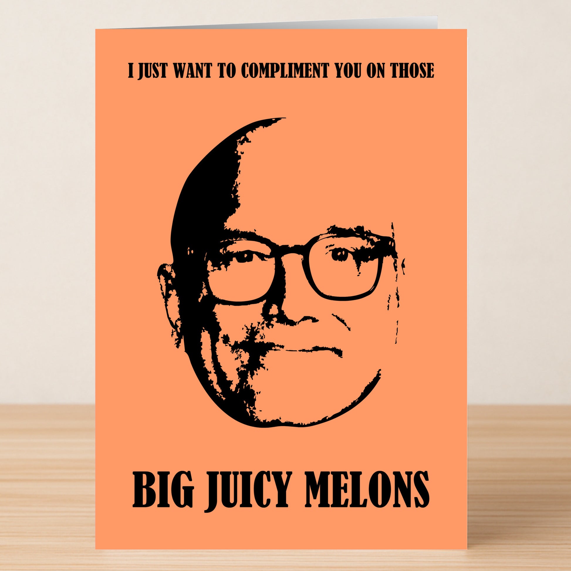 The Melons Rude Valentines Card by Twisted Gifts is orange and features a black-and-white drawing of a man's face with the funny message, "I just want to compliment you on those big juicy melons.