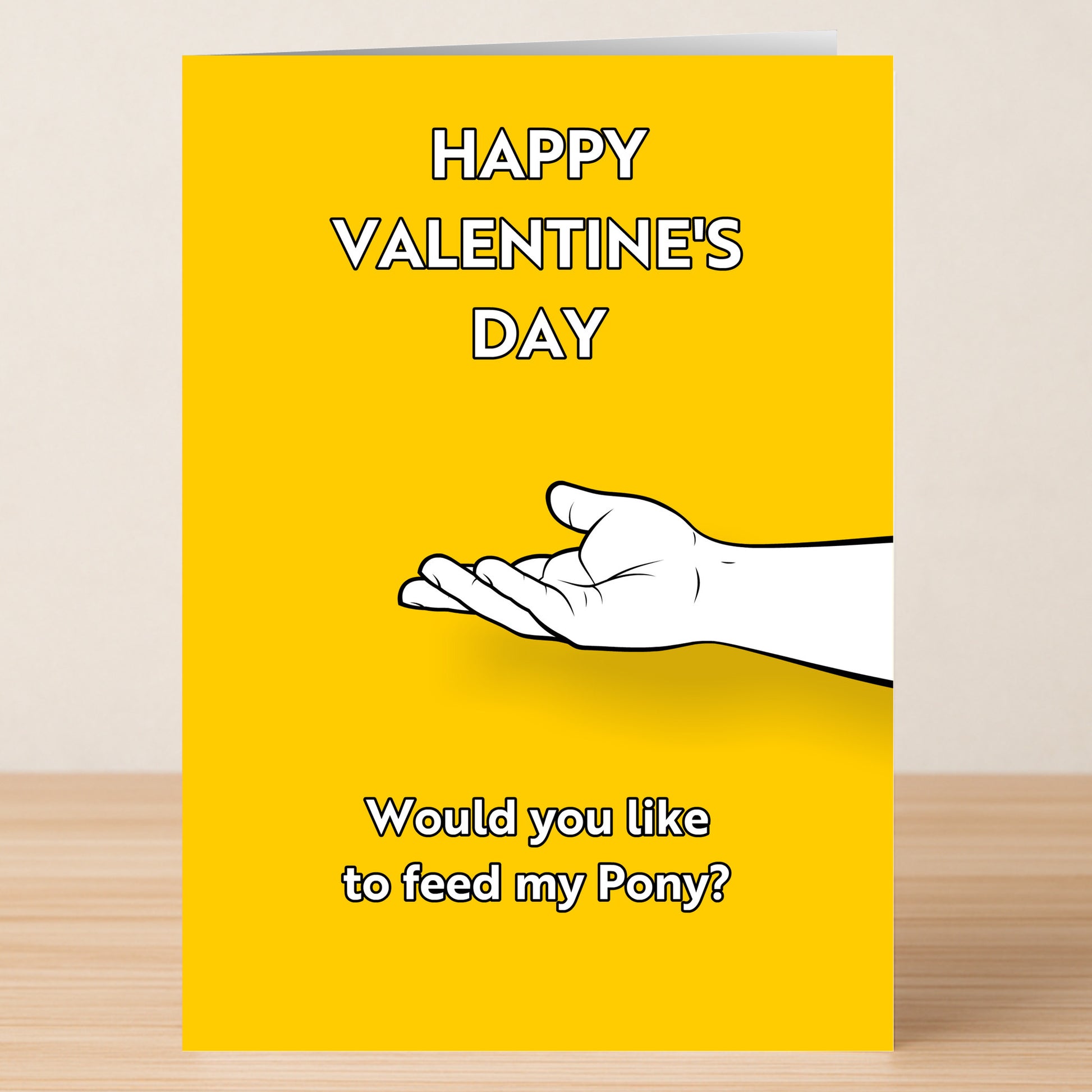 The Feed My Pony Rude Valentines Card by Twisted Gifts is a yellow card with "HAPPY VALENTINE'S DAY" above an outstretched hand and "Would you like to feed my Pony?" below—perfect for anyone who enjoys a cheeky Valentine's Day card.