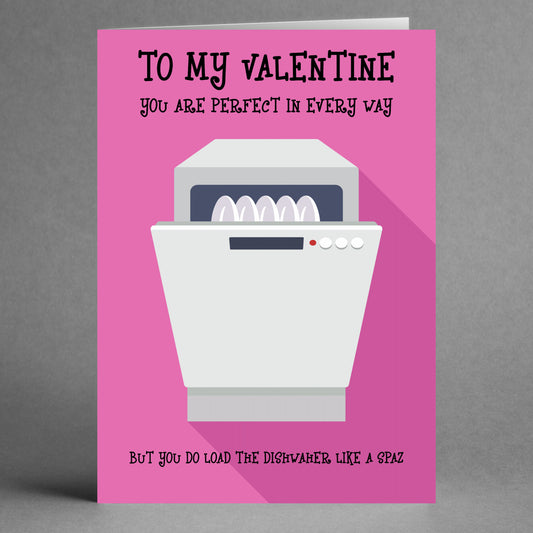 The Dishwasher Spaz Insulting Valentine's Card by Twisted Gifts features a playful pink design with a humorous dishwasher illustration, playfully mocking the art of loading it imperfectly for a lighthearted touch this Valentine's Day.