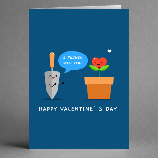 The "Dig You Funny Valentine's Card" by Twisted Gifts humorously depicts a shovel expressing affection to a heart-shaped plant in a pot with the message, "I dig you.