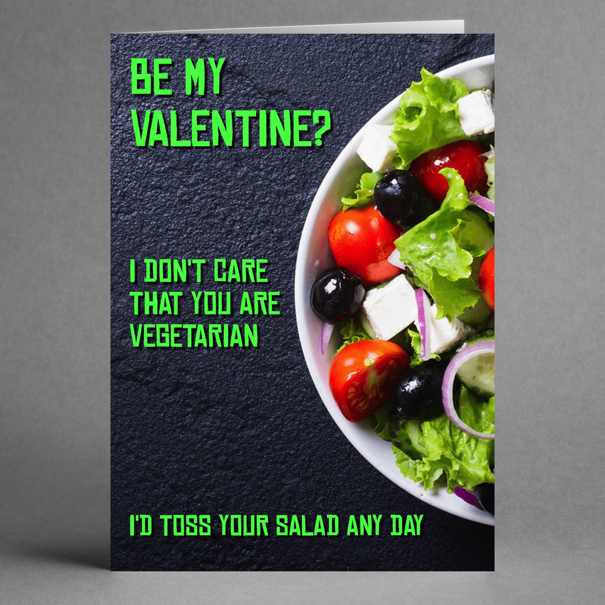 The Toss Your Salad Rude Valentine's Card by Twisted Gifts features a cheeky design of a bowl of salad with the text, "Be my Valentine? I don't care that you're vegetarian. I'd toss your salad any day." This card is ideal for anyone with a quirky sense of humor.