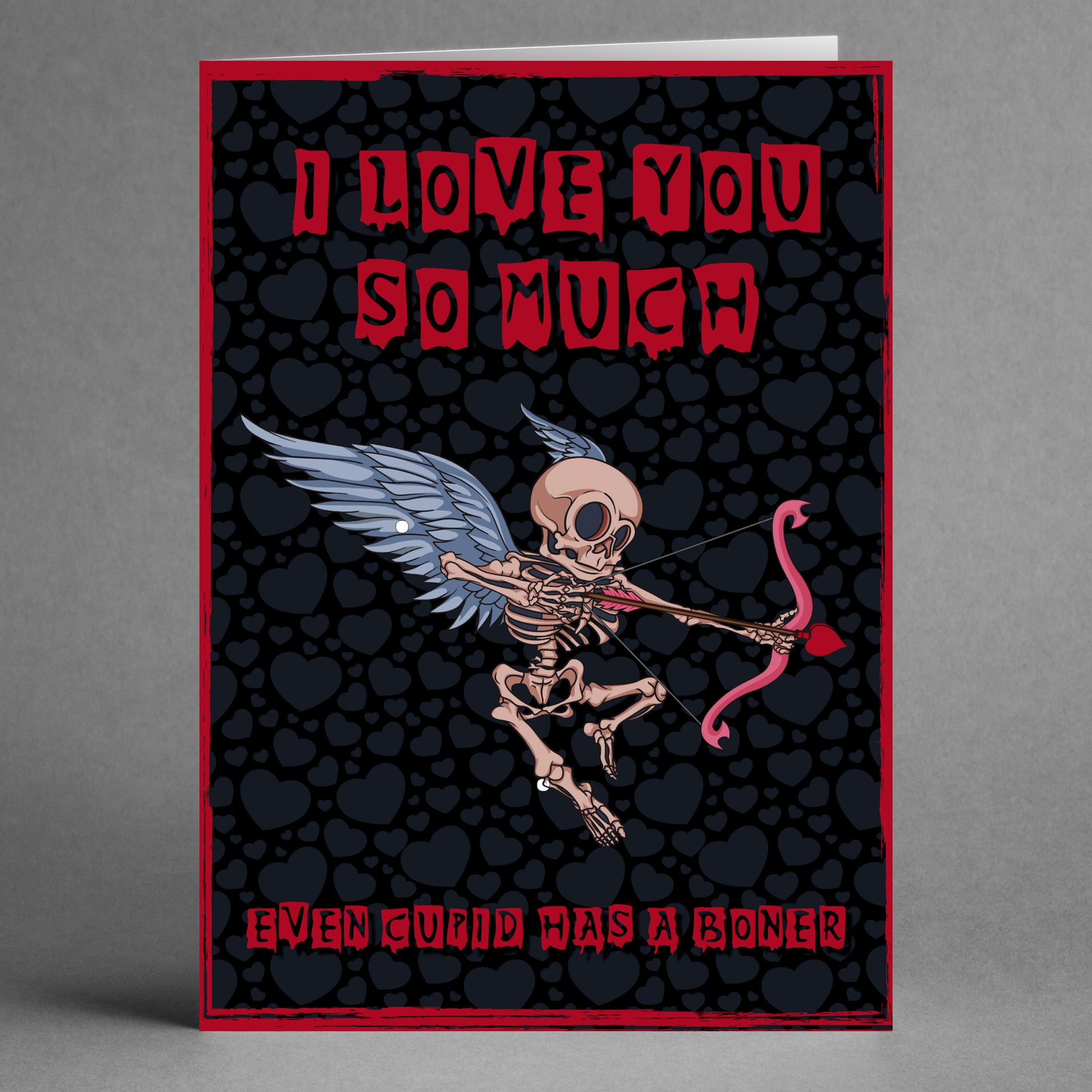 Twisted Gifts' Cupid Funny Valentine's Card showcases a hilarious skeleton cupid holding a bow and arrow with the caption, "I love you so much even Cupid has a boner." This card is an excellent choice for a distinctive and quirky Valentine's Day greeting!