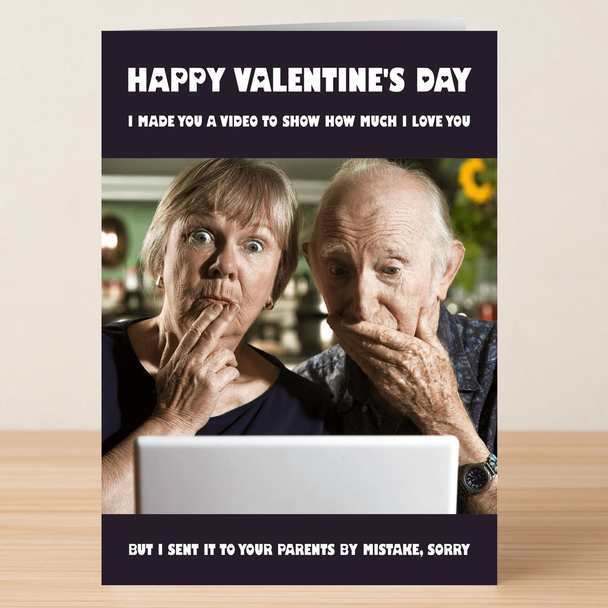 The Mistake Funny Valentine's Card by Twisted Gifts features an older couple surprised at a laptop with the message: "Happy Valentine's Day. I made you a video... but I sent it to your parents by mistake, sorry." Hilarious and unique!.