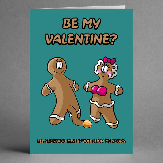 The Show Me Yours Rude Valentine's Card by Twisted Gifts humorously features cartoon gingerbread figures—one male and one female—alongside the playful text "Be My Valentine?". With a cheeky twist, the card adds at the bottom, "I'll show you mine if you show me yours.