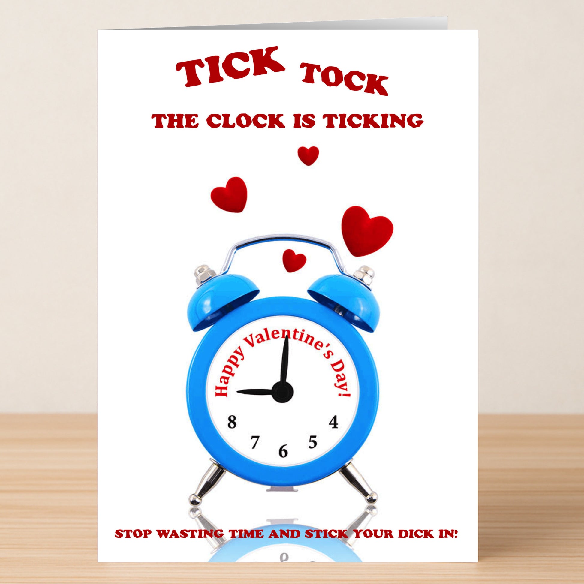 The Tick Tock Rude Valentine's Card by Twisted Gifts features a blue alarm clock, red hearts, and cheeky humor with the message: "Tick tock, the clock is ticking. Happy Valentine's Day! Stop wasting time and stick your dick in!.