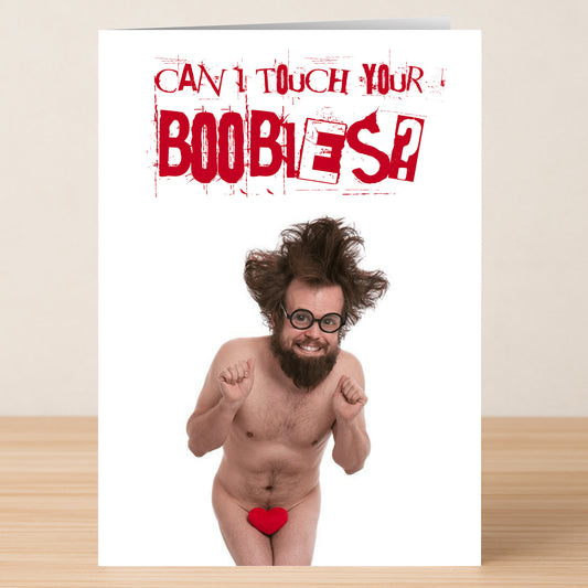 The Boobies Rude Greeting Card by Twisted Gifts features a naked man with messy hair and glasses, covering himself with a red heart and the cheeky message "Can I touch your boobies?"—perfect for a naughty Valentine.
