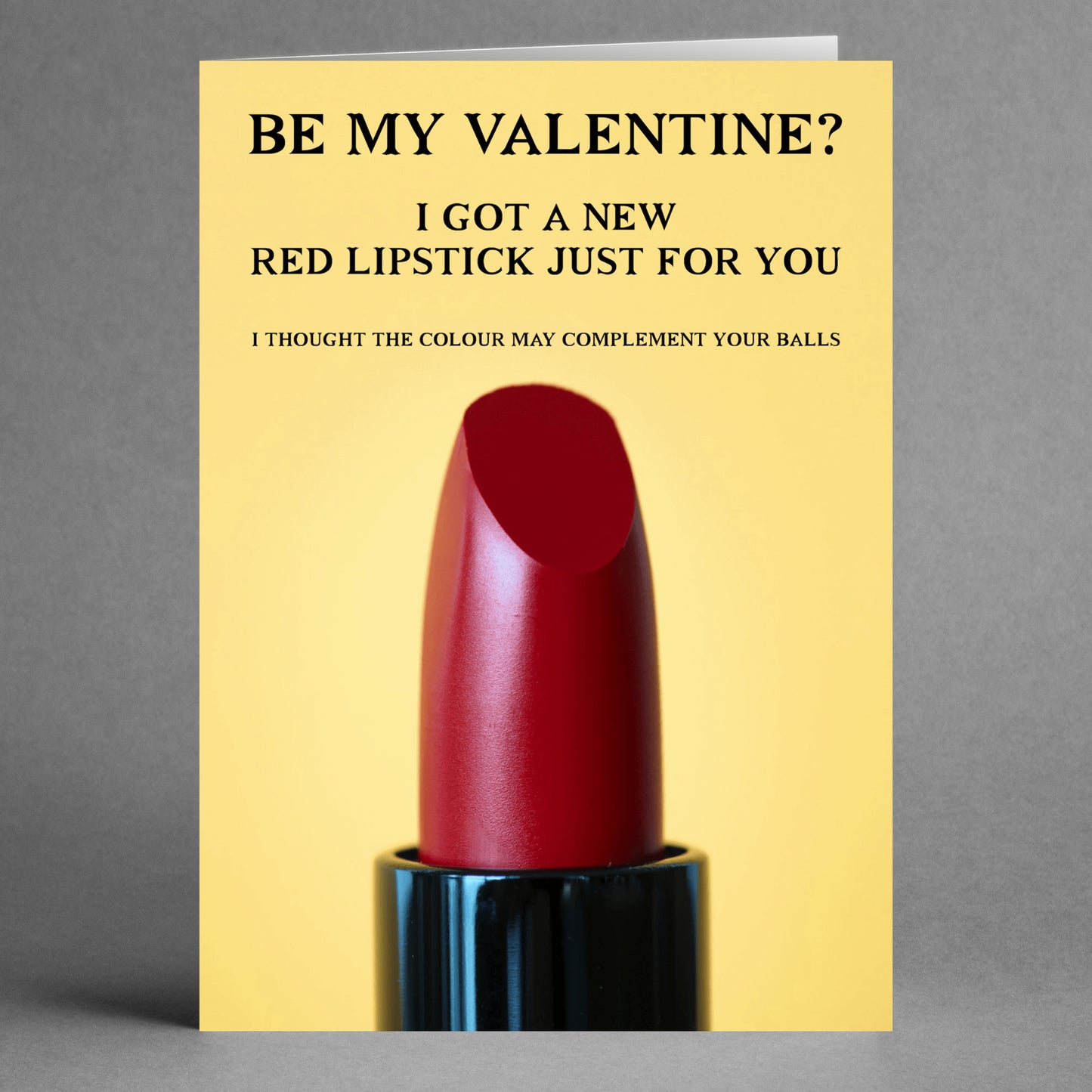 Surprise your special someone with the Complement Rude Valentine's Card by Twisted Gifts, featuring a cheeky red lipstick design paired with humorous text on how the color complements golf balls—an ideal way to bring a playful twist to Valentine's Day!