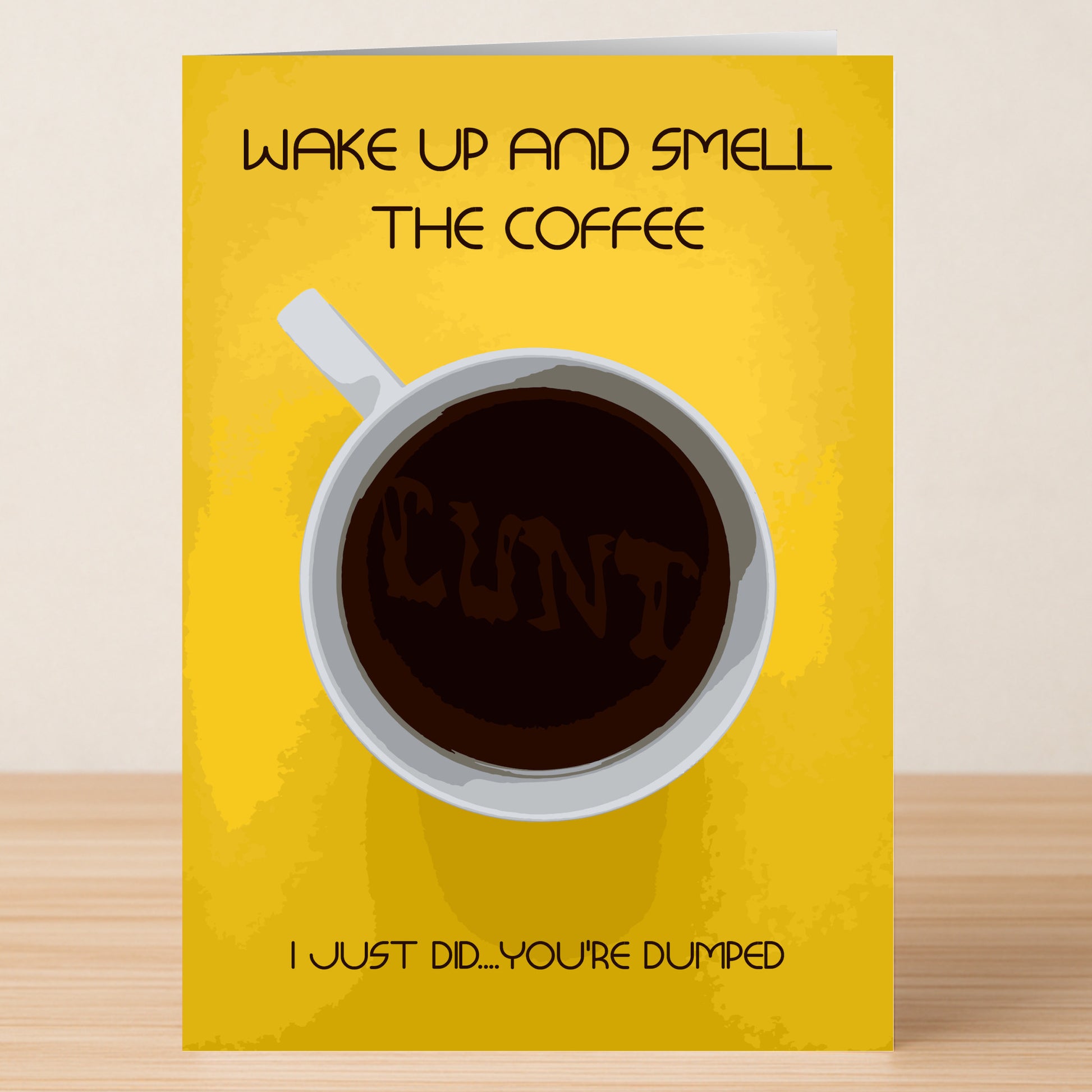 The Smell The Coffee Rude You're Dumped Card by Twisted Gifts features a bold yellow design with a coffee cup spelling "CUNT," plus the messages "WAKE UP AND SMELL THE COFFEE" and "I JUST DID... YOU'RE DUMPED." Perfect for sassy breakups.
