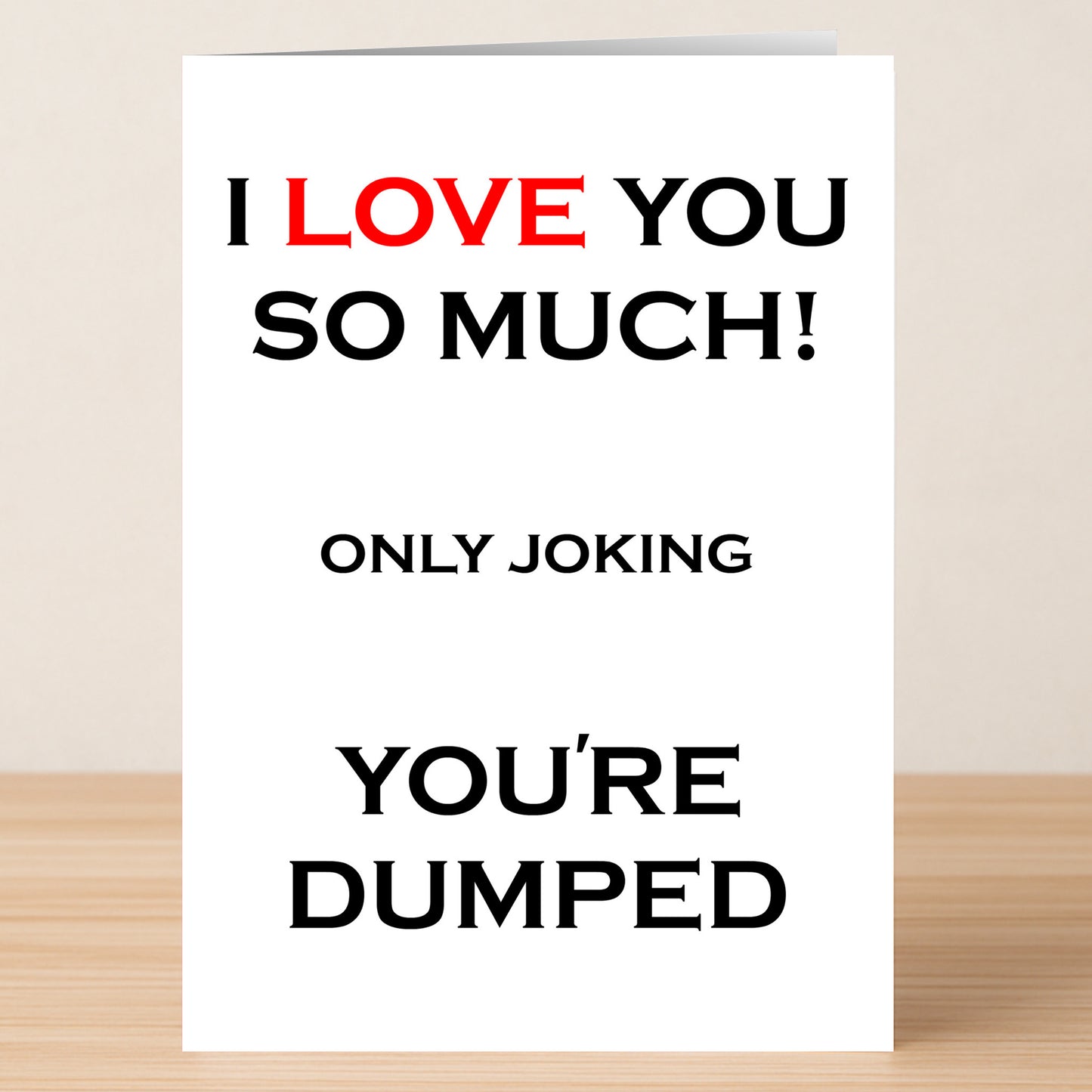 The Dumped Funny You're Dumped Card by Twisted Gifts features bold text—“I LOVE YOU SO MUCH! ONLY JOKING YOU'RE DUMPED,” with "LOVE" in red—a hilarious greeting card sure to spark laughter.