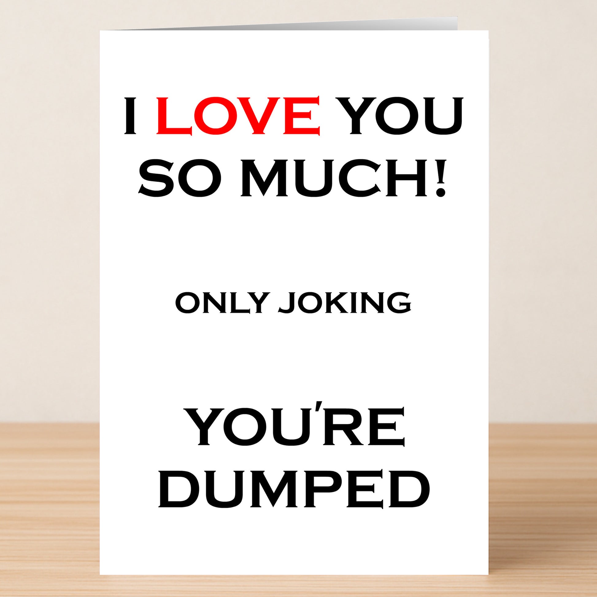 The Dumped Funny You're Dumped Card by Twisted Gifts features bold text—“I LOVE YOU SO MUCH! ONLY JOKING YOU'RE DUMPED,” with "LOVE" in red—a hilarious greeting card sure to spark laughter.