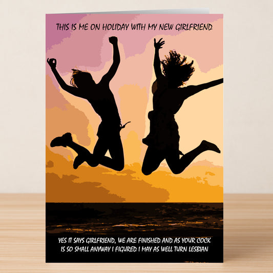 Two people leap at sunset with the "Turn Lesbian Insulting You're Dumped Card" by Twisted Gifts, showcasing a humorous breakup message about holidaying with a new girlfriend and playfully moving on after splitting up.