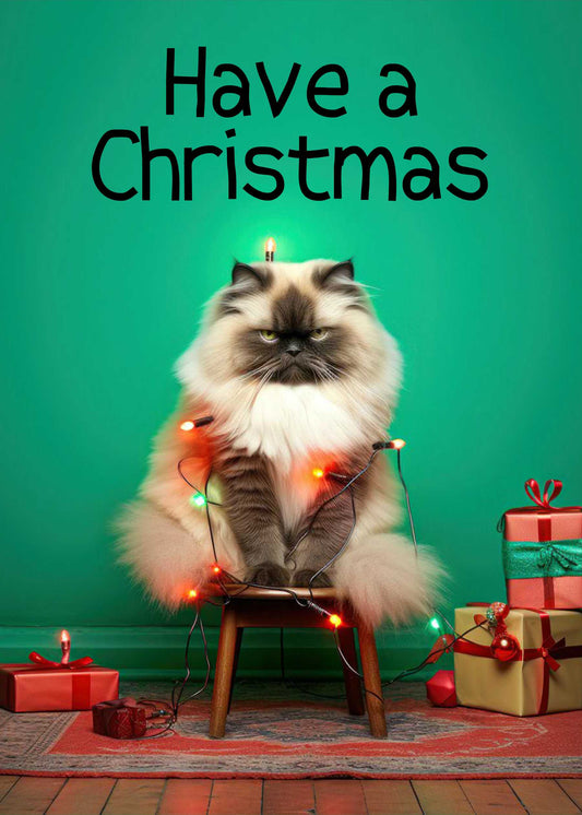 A fluffy cat sits on a chair wrapped in Christmas lights with presents nearby, under the text "Have A Christmas" against a green background. Twisted Gifts’ "Have A Christmas Funny Christmas Card" is perfect for delivering festive holiday greetings with a playful twist.