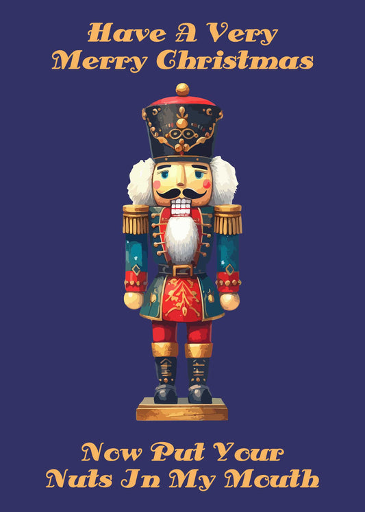 Illustration of a nutcracker soldier with text above and below it. The top text reads "Have A Very Merry Christmas" and the bottom text humorously says "Now Put Your Nuts In My Mouth." Perfect for spreading some holiday cheer, the Twisted Gifts' *In My Mouth Rude Christmas Card* is sure to make everyone smile.