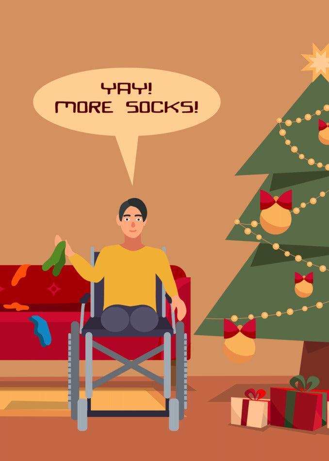 A man in a wheelchair sitting in front of a Christmas tree wearing Twisted Gifts' More Socks Funny Christmas Card.