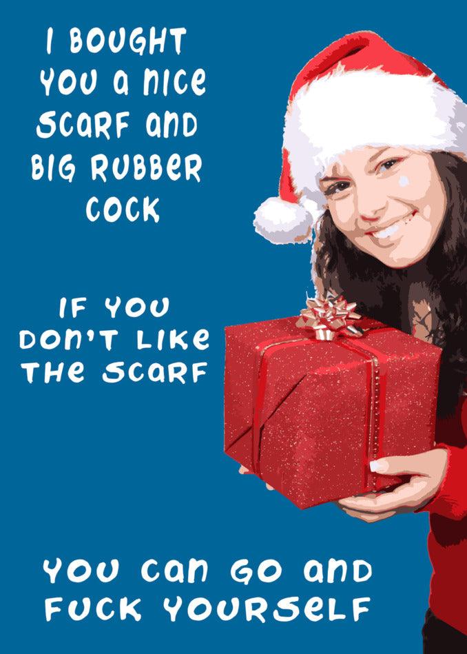A woman holding a funny Twisted Gifts Nice Scarf Rude Christmas Card with the words "i bought a nice scarf and a rubber rucksack if you don't mind" as she poses for a Christmas Card.
