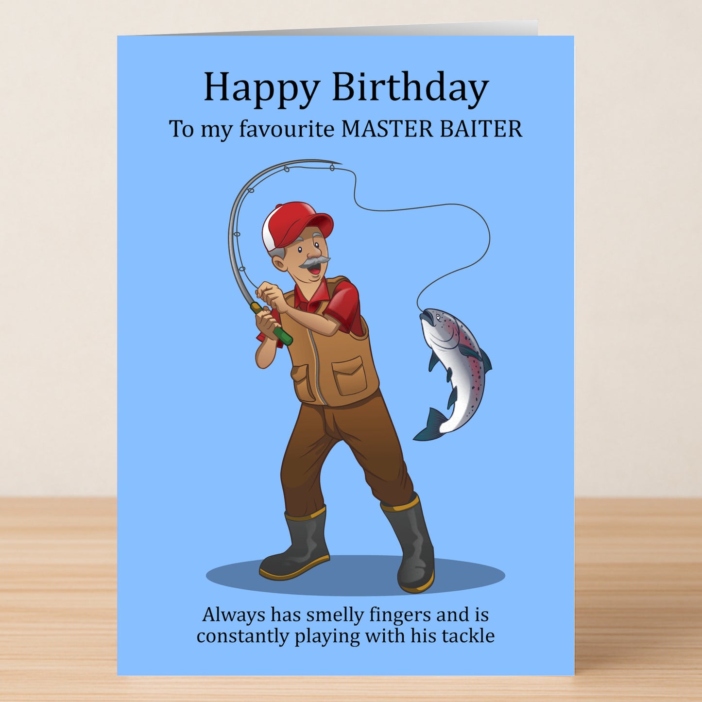 The Master Baiter – Rude Birthday Card by Twisted Gifts features a cartoon fisherman with his catch, packed with fishing puns, cheeky jokes about smelly fingers and tackle—perfect for a hilarious birthday surprise.