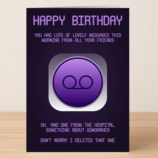 The Gonorrhea – Funny Birthday Card by Twisted Gifts features a purple voicemail icon and cheeky, slightly offensive text about deleting a hospital message. The card stands upright on a wooden surface.