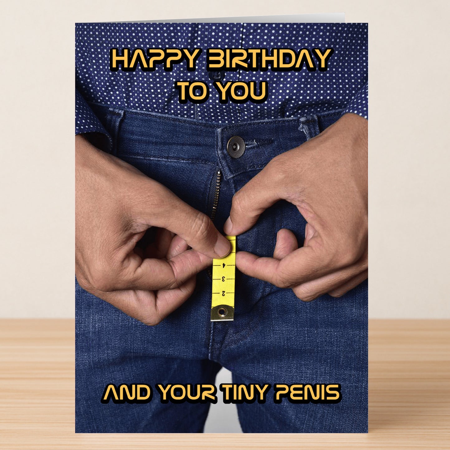 Give the gift of laughter with Twisted Gifts’ "Tiny Penis – Insulting Birthday Card." Featuring a jeans-clad figure measuring their crotch, this rude birthday card is sure to make an unforgettable impression!.