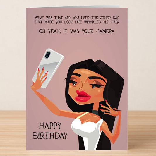 The "What App – Insulting Birthday Card" by Twisted Gifts features a cartoon woman taking a selfie and a witty message about photo filters—ideal for anyone who appreciates funny, light-hearted birthday greetings.