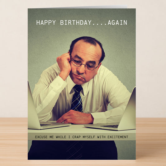 The Excitement – Funny Birthday Card by Twisted Gifts shows a man in a shirt and tie, bored between two laptops. The card reads, "HAPPY BIRTHDAY....AGAIN" and "EXCUSE ME WHILE I CRAP MYSELF WITH EXCITEMENT.