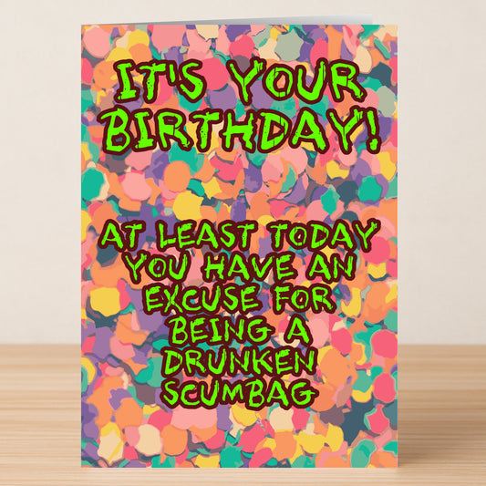 The Scumbag – Insulting Birthday Card by Twisted Gifts features bold text: "IT'S YOUR BIRTHDAY! AT LEAST TODAY YOU HAVE AN EXCUSE FOR BEING A DRUNKEN SCUMBAG." Perfect for friends with a sense of humor.