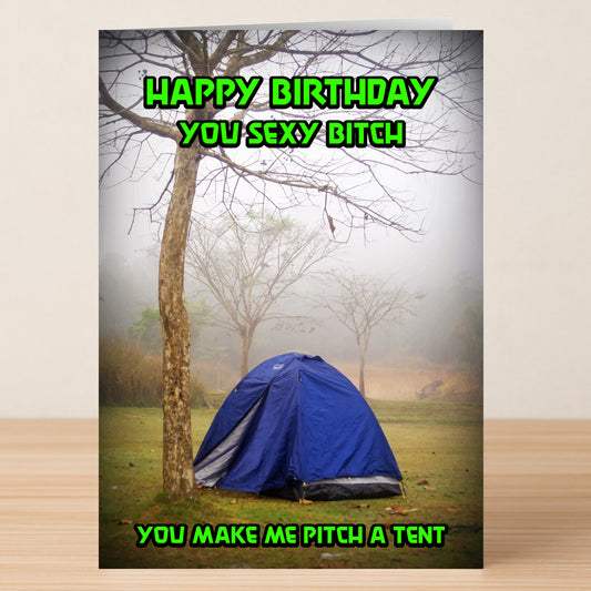 The Pitch A Tent – Rude Birthday Card by Twisted Gifts features a blue tent under a tree in foggy outdoors, with bold green text: "Happy Birthday you sexy bitch. You make me pitch a tent." Perfect for anyone with a wicked sense of humor.