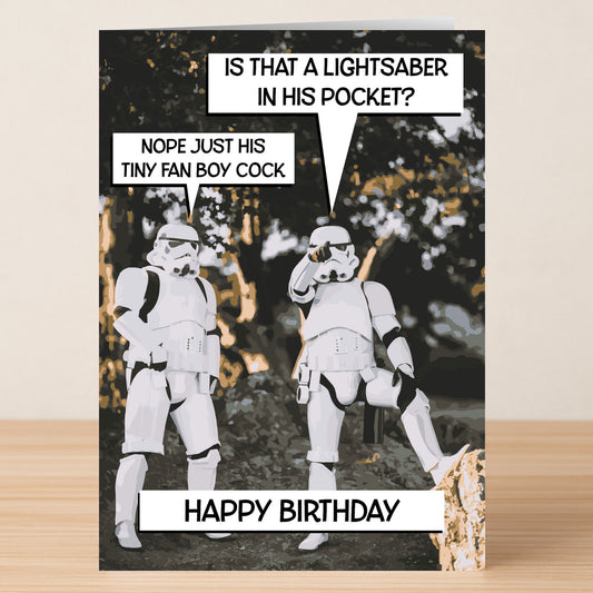 Two people in stormtrooper costumes joke about a lightsaber with speech bubbles. "Happy Birthday" is printed at the bottom of this funny Lightsaber – Rude Birthday Card by Twisted Gifts.
