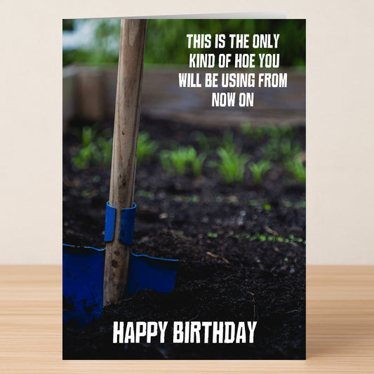 The Hoe – Rude Birthday Card by Twisted Gifts features a garden hoe in soil with the message, “This is the only kind of hoe you will be using from now on. Happy Birthday.”.
