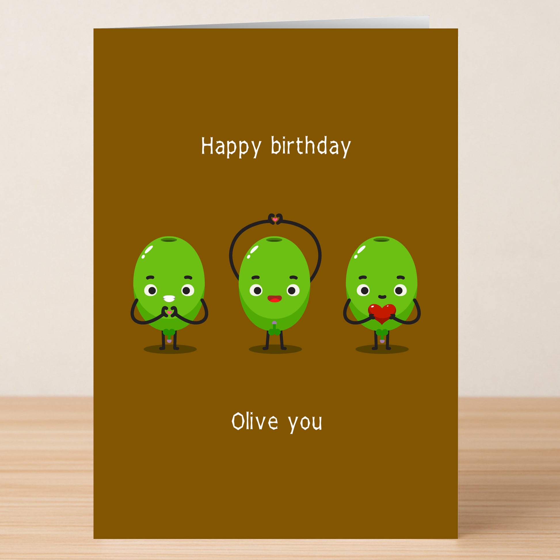 Give the gift of laughter with Twisted Gifts’ Olive You Funny Birthday Card—three cartoon green olives holding hearts and playful "Happy birthday" and "Olive you" text make it perfect for pun lovers!.