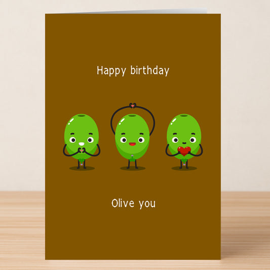 Give the gift of laughter with Twisted Gifts’ Olive You Funny Birthday Card—three cartoon green olives holding hearts and playful "Happy birthday" and "Olive you" text make it perfect for pun lovers!.