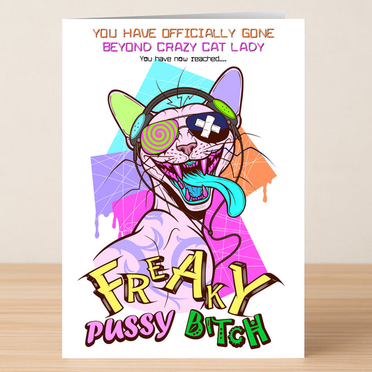 Bright cartoon cat with headphones, sunglasses, and tongue out. Cat Lady – Funny Birthday Card by Twisted Gifts features bold "Freaky Pussy Bitch" text—an amusing pick for the wild cat lover in your life!.