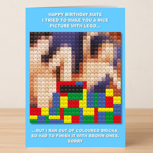 The Twisted Gifts "Lego – Rude Birthday Card" is a funny card showing a LEGO design on wood, with a joke about using brown bricks to finish the picture after running out of colored ones.