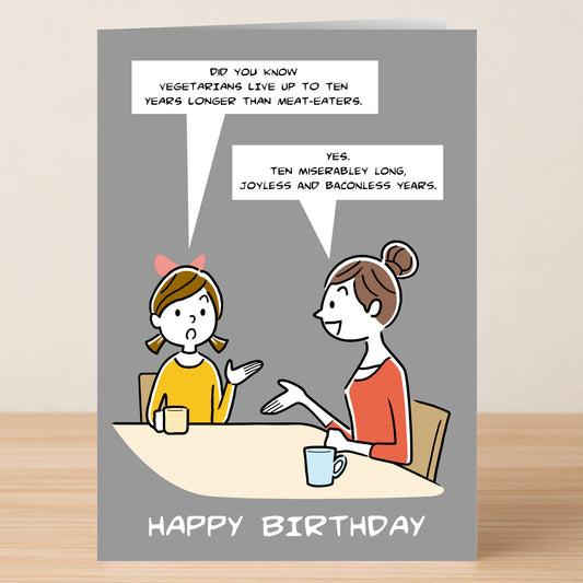 The Baconless – Funny Birthday Card by Twisted Gifts features two cartoon women joking about vegetarians living longer but missing out on bacon. With "HAPPY BIRTHDAY" below, it's perfect for anyone who loves a good laugh!.