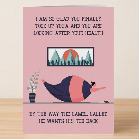 The Camel – Insulting Birthday Card by Twisted Gifts shows a woman doing yoga with her dog, joking about her flexibility and teasing that even a camel wants his toe back—a hilariously offensive birthday greeting!.